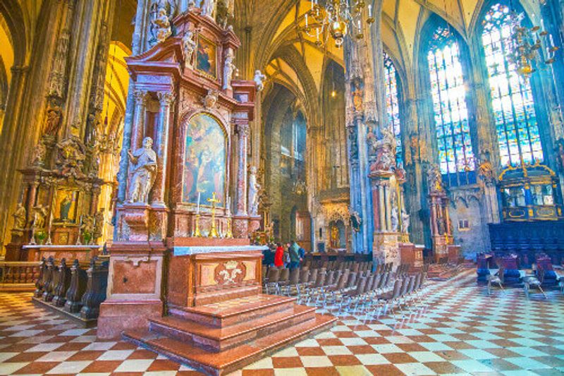 The icons in the prayer hall of St. Stephens Cathedral are framed in stone kiots with carved sculptures.