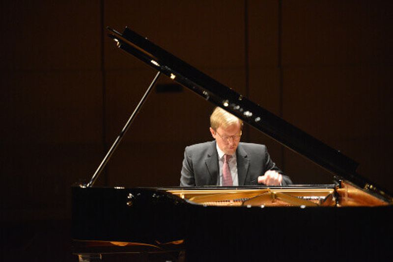 Professor Jan Jiracek von Arnim playing the piano.