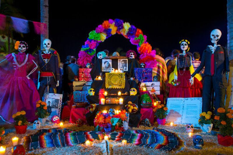 Day of the Dead street decorations with offerings