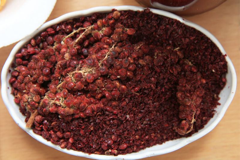 Red Sumac powder is displayed on a plate.