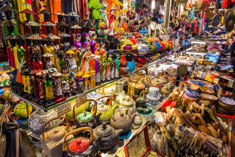 An abundance of souvenirs on shelves in a shop in Ben Thanh Market.