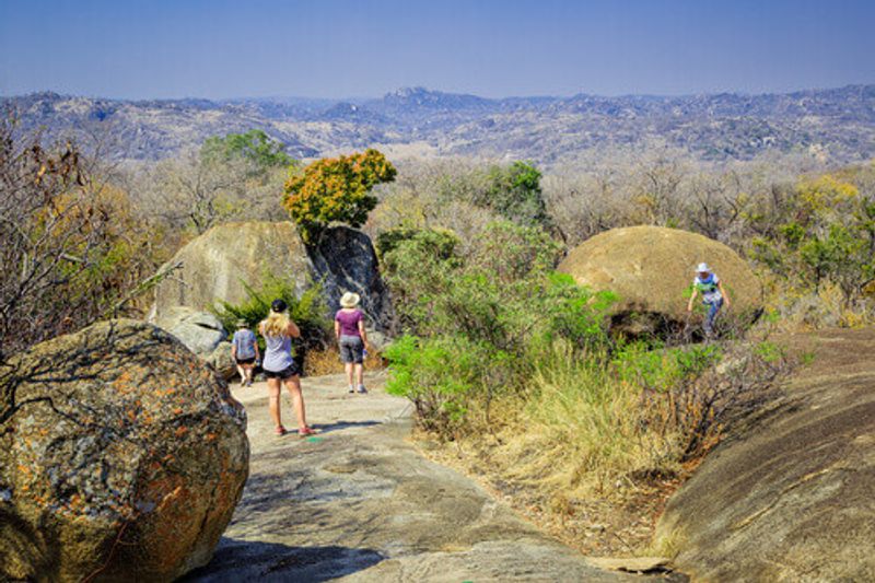 Tourists walking among the rocks in the Matobo National Park in Bulawayo.