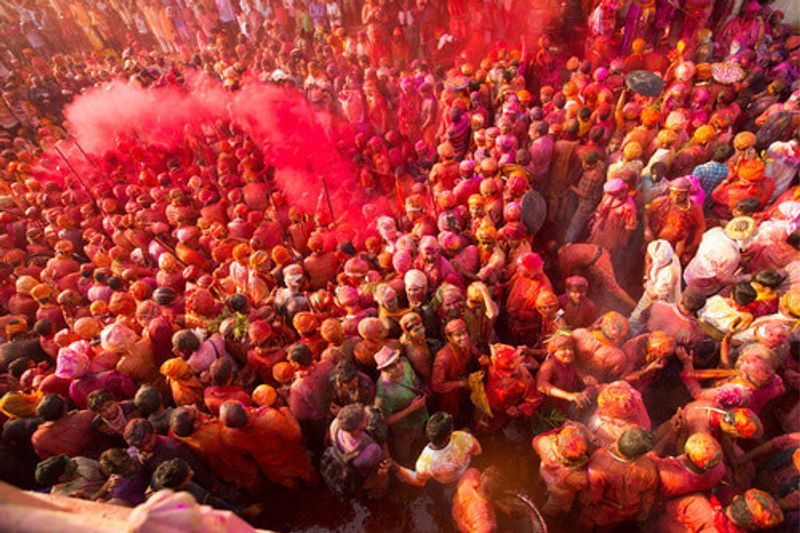 People celebrating the Holi festival in Nandgaon, Uttar Pradesh,  India.