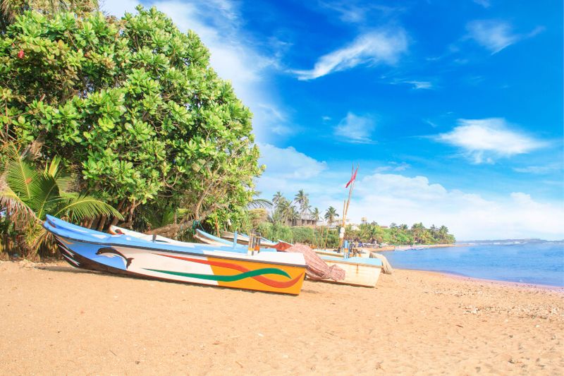 Sailing and fishing boats on the shores of Bentota Beach