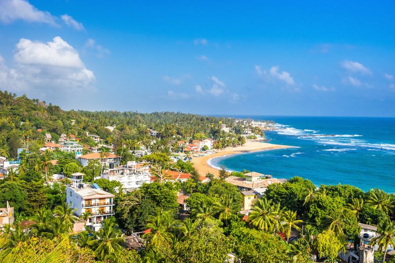 Panoramic view of the Unawatuna Beach from the rooftop of a hotel.