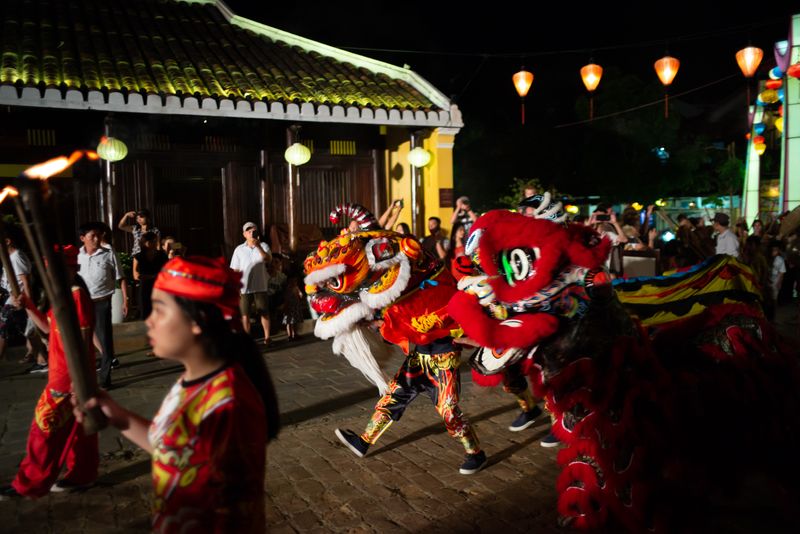 Lion dance performers at Hùng Kings Festival, showcasing traditional rituals and folk celebrations in Vietnam