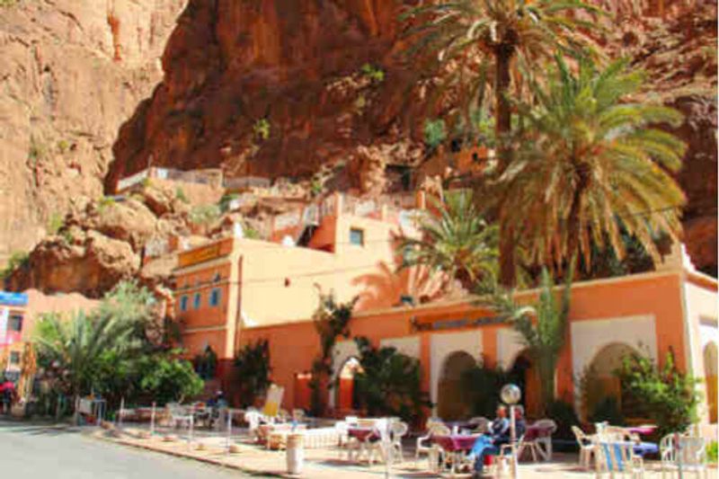 Tourists sitting outside a hotel cafe in Tinerhir, Morocoo.