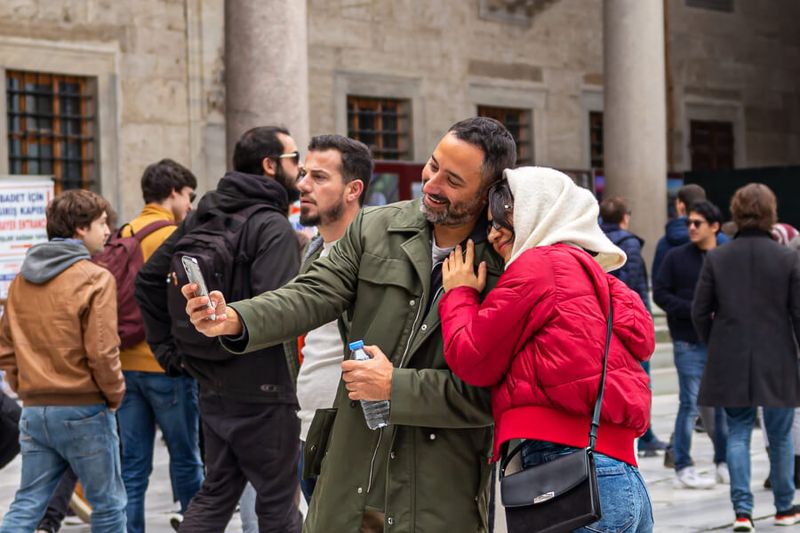 A couple taking a selfie at the courtyard of Blue Mosque