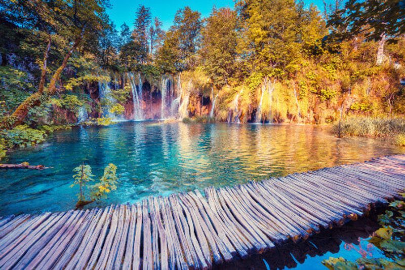Majestic view of turquoise water and trees in the Plitvice Lakes National Park.