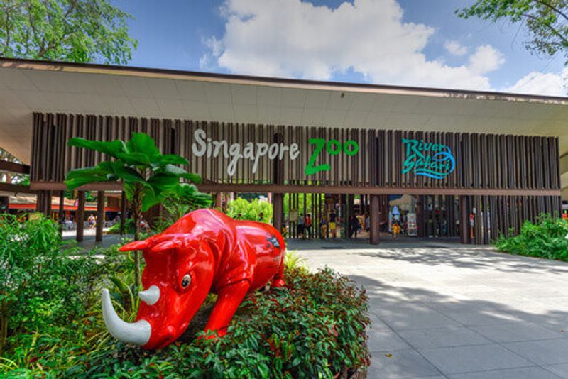 Singapore Zoo entrance with welcoming red rhino sculpture