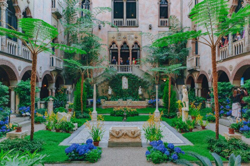 Interior view of the inner courtyard and gardens of the Isabella Stewart Gardner Museum.