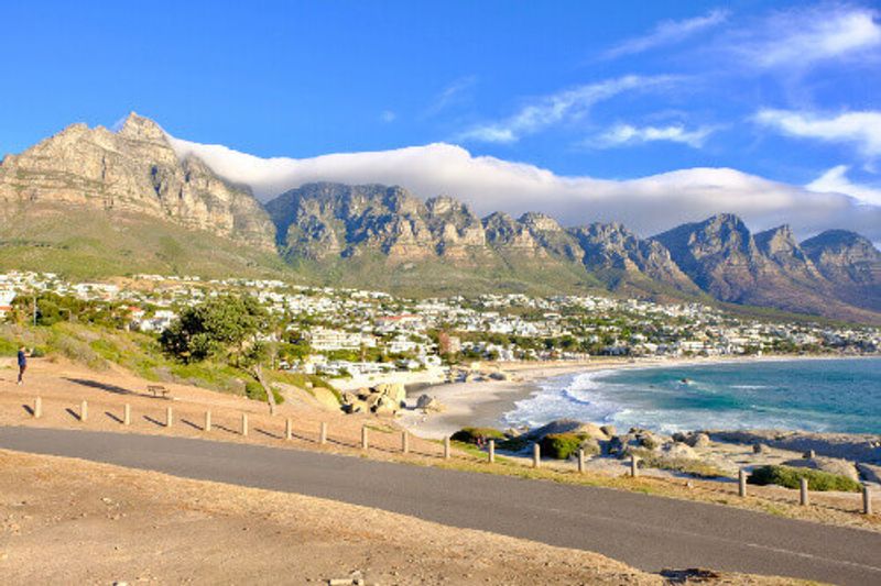 The Twelve apostles and Camps Bay Beach with some beautiful white clouds in Hout Bay.