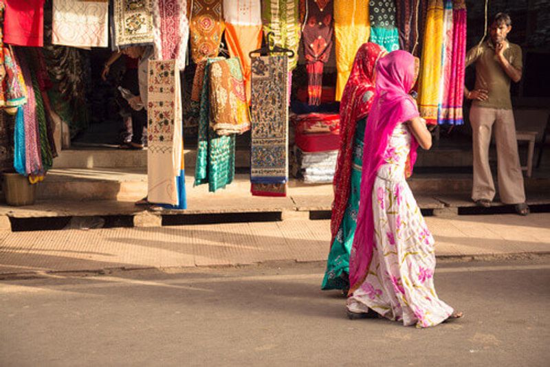 Two women walking on the streets of Pushkar.