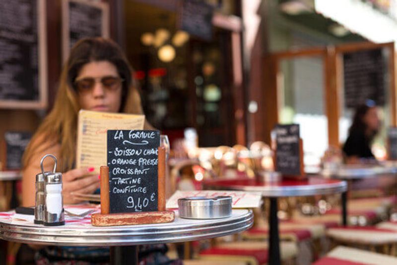 The menu is in focus at a typical French restaurant in France.