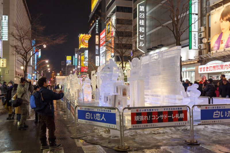 Visitors viewing the large ice sculptures.