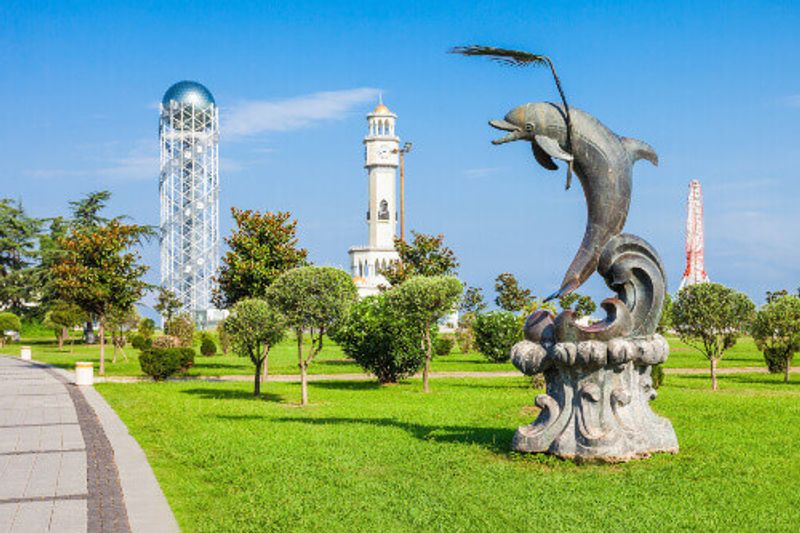 Dolpin statue and the Alphabet Tower in the background.