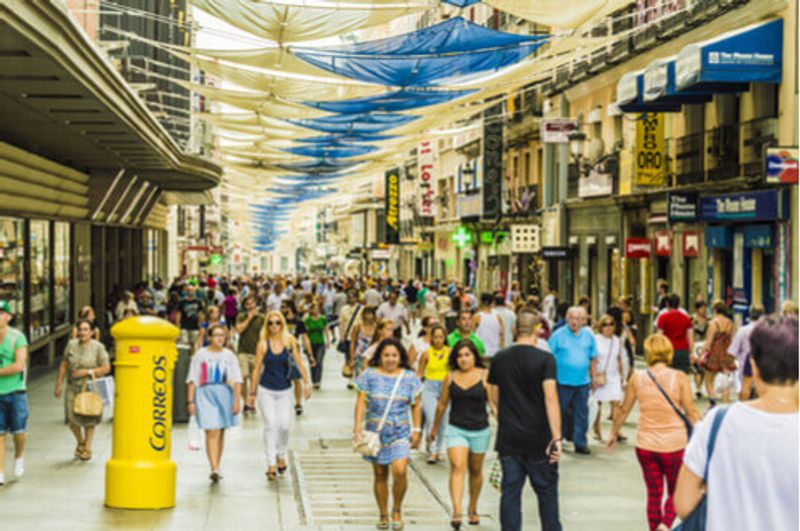 A picturesque shopping street in Madrid, Spain.