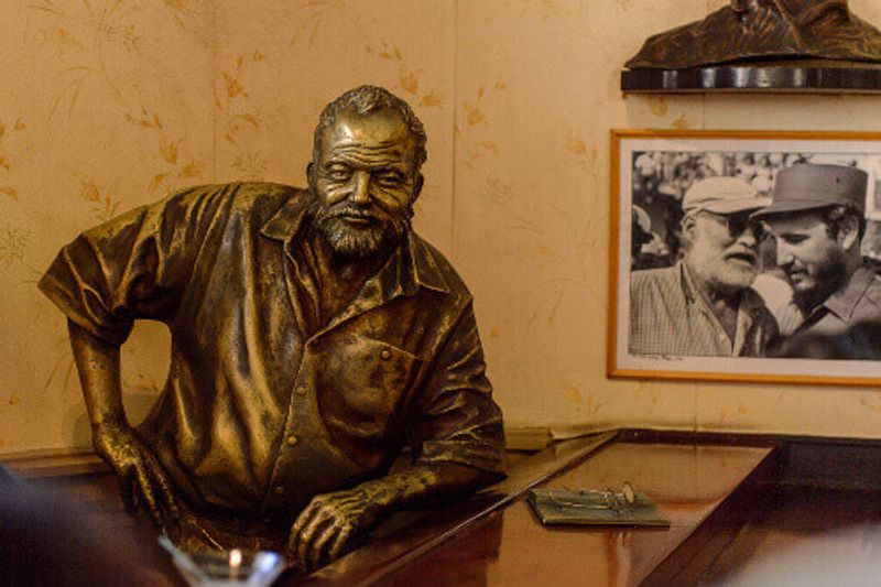 Sculpture of Ernest Hemingway in El Floridita, a historic fish restaurant and cocktail bar in La Habana Vieja.