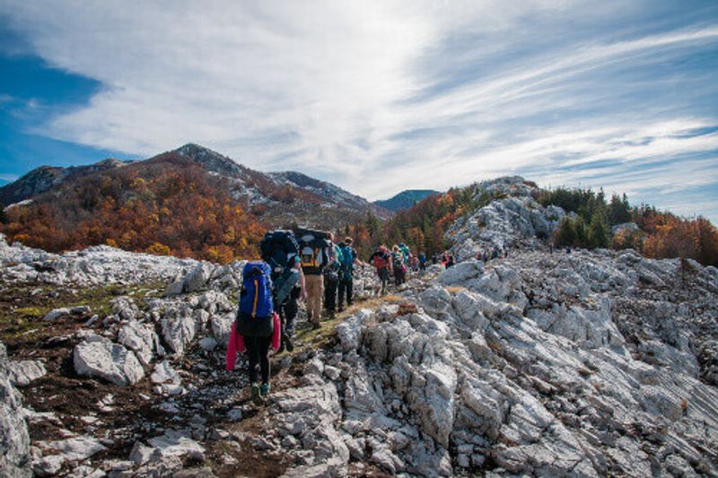 Tourists hiking up a path in the Velebit Mountains in the Paklenica National Park.