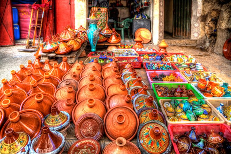 Local markets in Fes sell wares such as bright crockery.