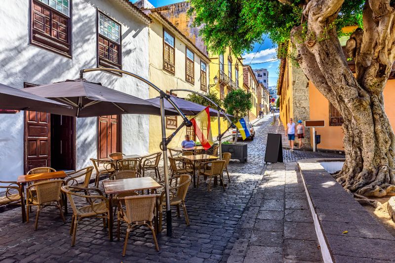 The historic downtown area in Icod de los Vinos during a siesta with shops closed and less people out and about.