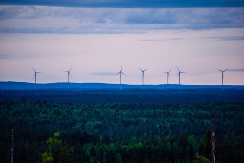 Wind Turbines in a forest in Lapland.