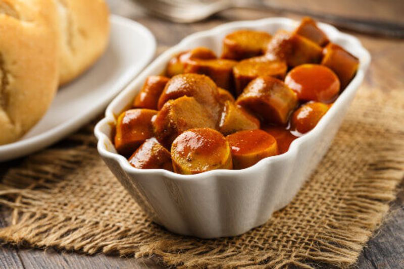 German currywurst with pieces of curried sausage