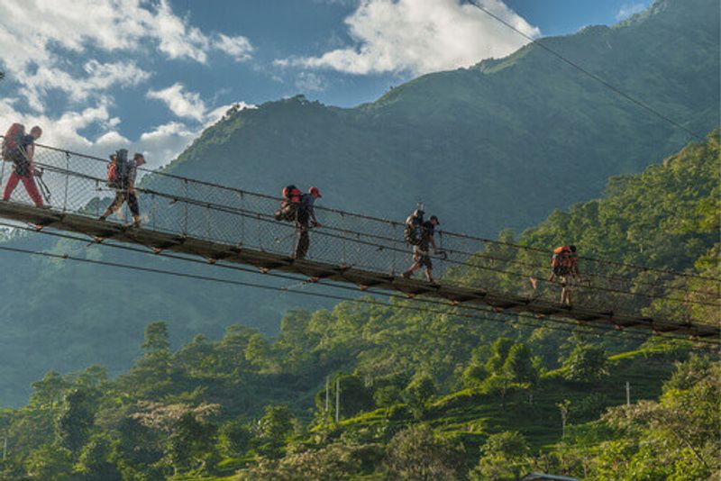 People hike on the Annapurna Circuit trek in the Himalayas, Nepal.