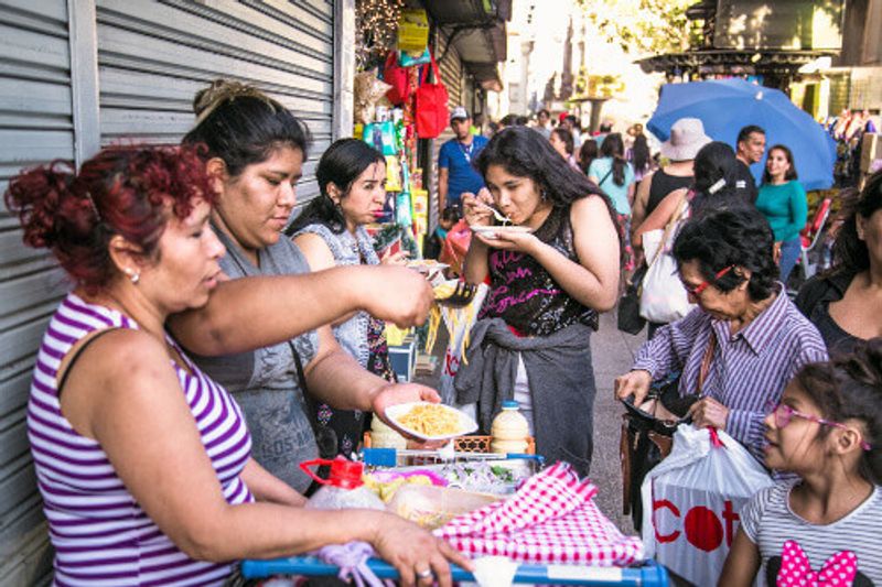 Locals sell street food on the Plaza de Armas in Santiago de Chile.