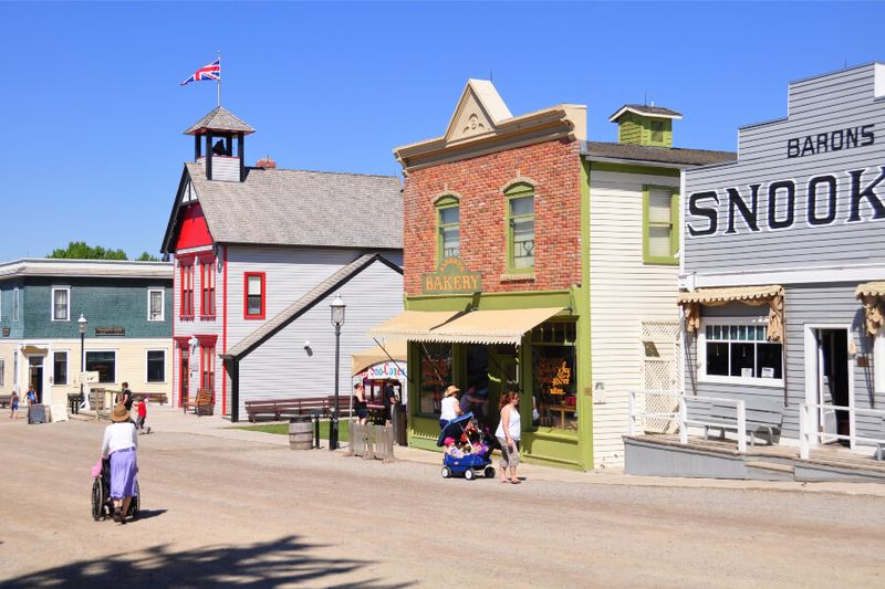 Tourists take in the living museum that is Heritage Park Historical Village.