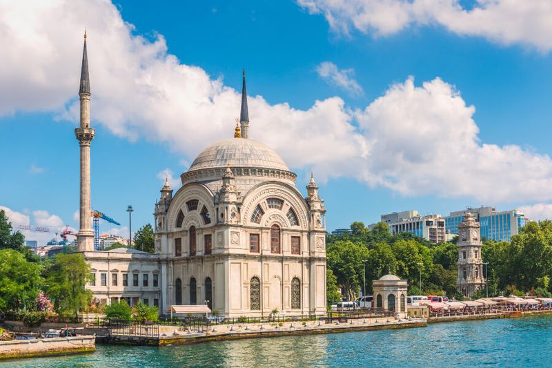 The Dolmabahce Mosque sits in all its magesty on the banks of Bosphorus Strait.