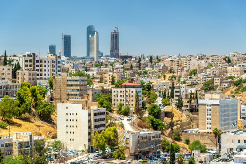Cityscape of downtown Amman with skyscrapers and buildings.