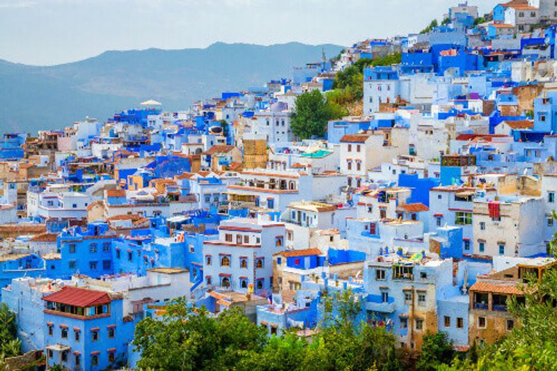 An aerial view of the blue houses of the city of Chefchaouen.