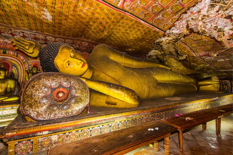 A statue of the reclining Buddha in the ancient Buddhist cave temple at Dambulla.