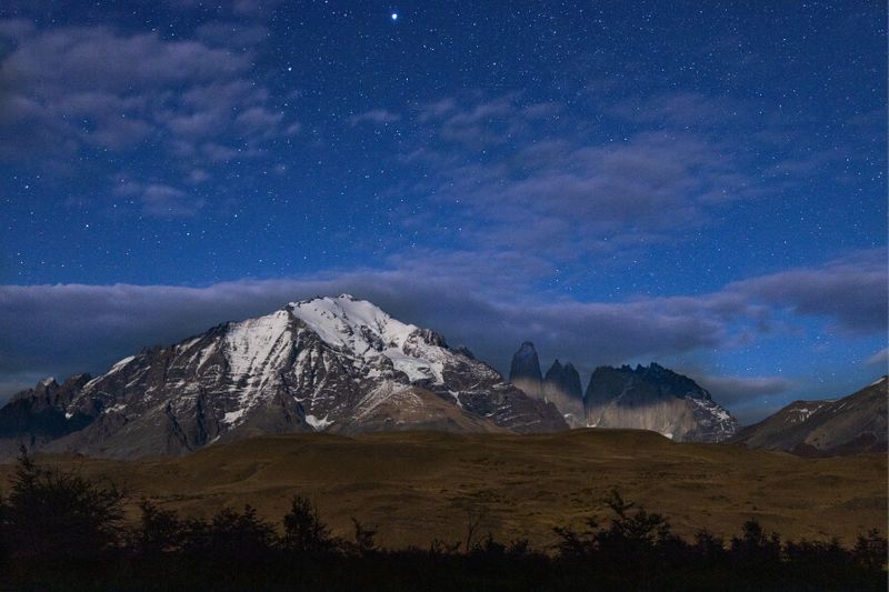 Panoramic view of the Torres mountains in Torres del Paine National Park at night