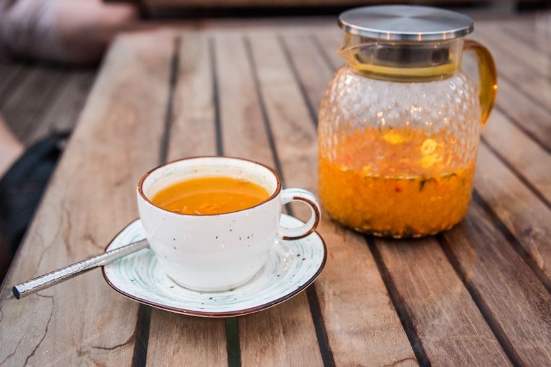 A pot of Kyrgyz tea infused with sea-buckthorn berries and citrus, a favourite drink in Bishkek cafés.
