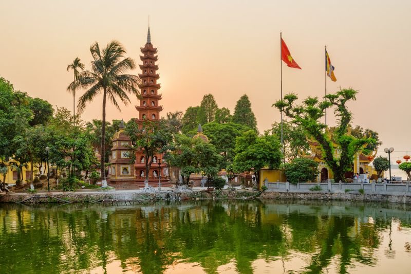 Stunning sunset view of the Tran Quoc Pagoda and the West Lake