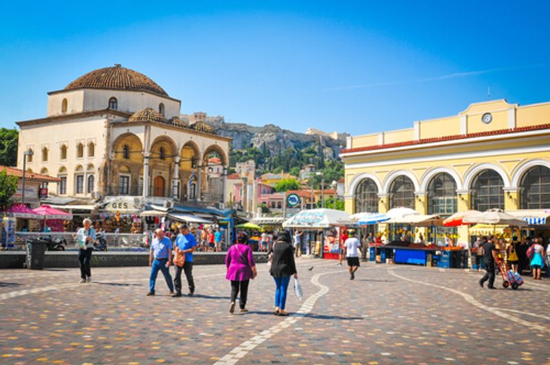 Tourists and locals walk in the streets of Monastiraki.