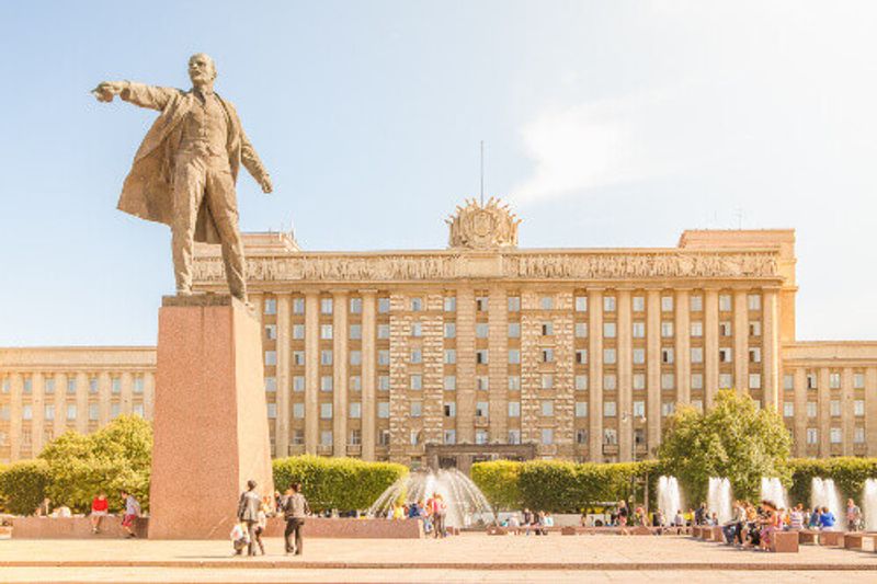 The modern complex of holiday fountains in Moscow Square with a statue of Lenin in Saint Petersburg.