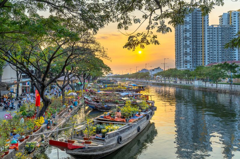 Boats docked by flower markets during the Lunar New Year