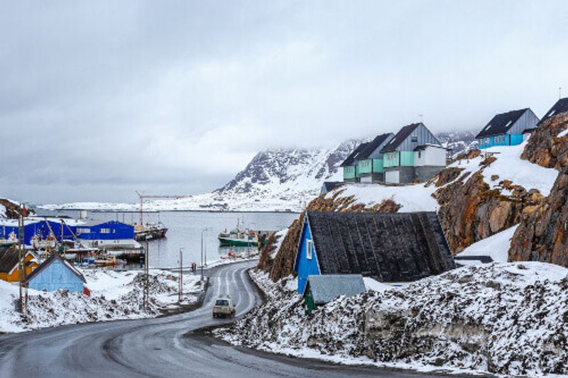 Acrtic road to the docks with Inuit houses in Sisimiut.
