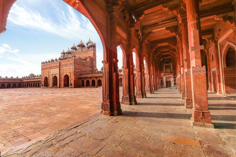 The Fatehpur Sikri red sandstone view with large columns, an example of Mughal architecture.