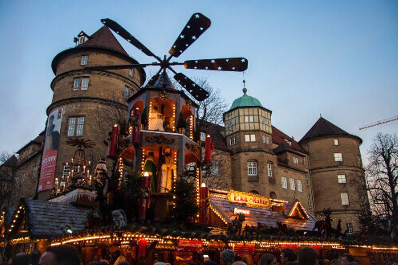 The Christmas Market with beautiful colorful light installations in the Old Castle, Stuttgart.