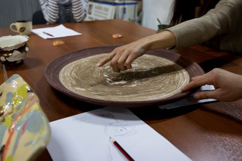 Japanese instructor teaching the Nerikomi style of pottery