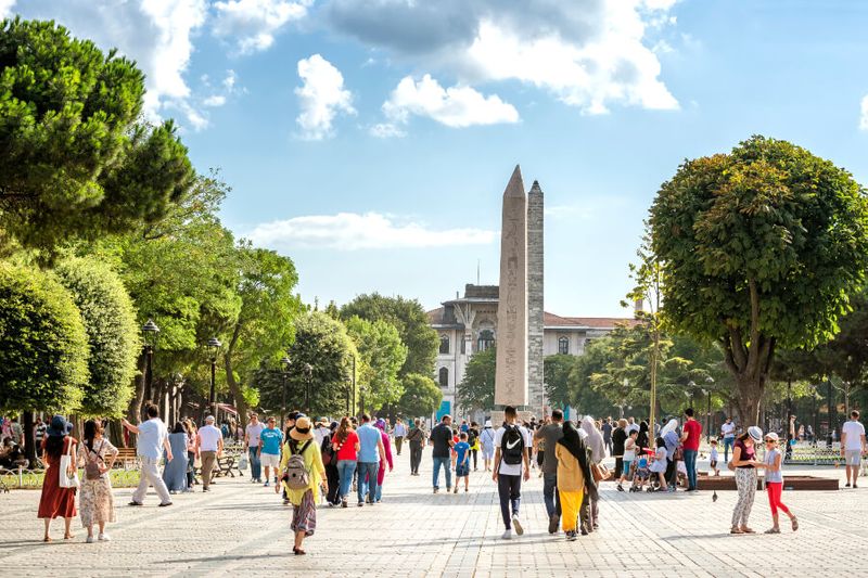 People walking at Sultan Ahmet Square,  the old Hippodrome of Constantinople.