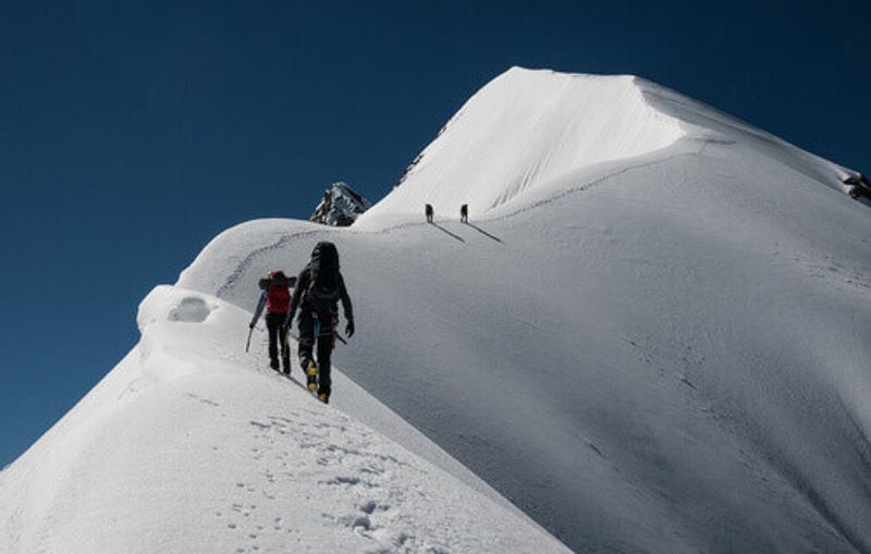 A group of climbers ascending Piz Bernina in St Moritz, Switzerland.