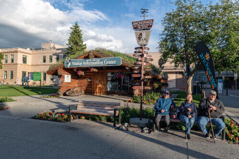 Locals pose for photo on park bench near the visitor centre in Anchorage.