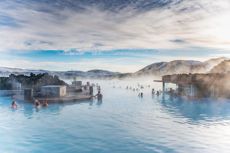 Tourist soaking at the geothermal bath resort of Blue Lagoon in the south of Iceland.