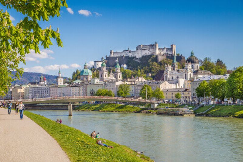 Beautiful view of Salzburg skyline with Festung Hohensalzburg and Salzach River in sight.