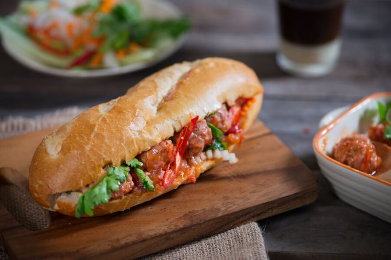 The Vietnamese sandwich called Banh Mi which is made out of a french baguette like bread, meat, coriander leaves, and carrot pickle